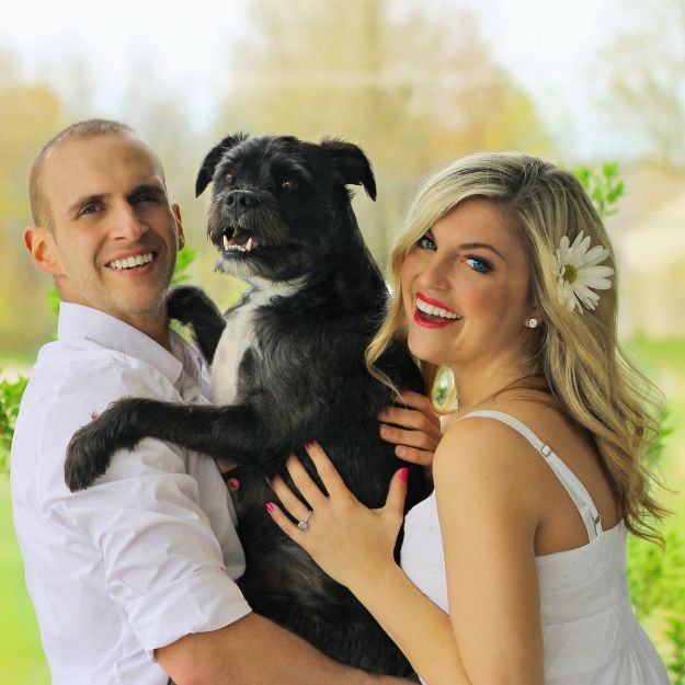 MAC Animal Hospital staff holding puppies corner of modern building
