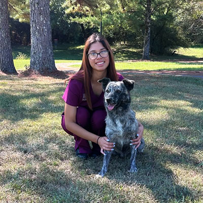 Fernanda-Receptionist-400px-sq-1 Fernanda with her dog in a park